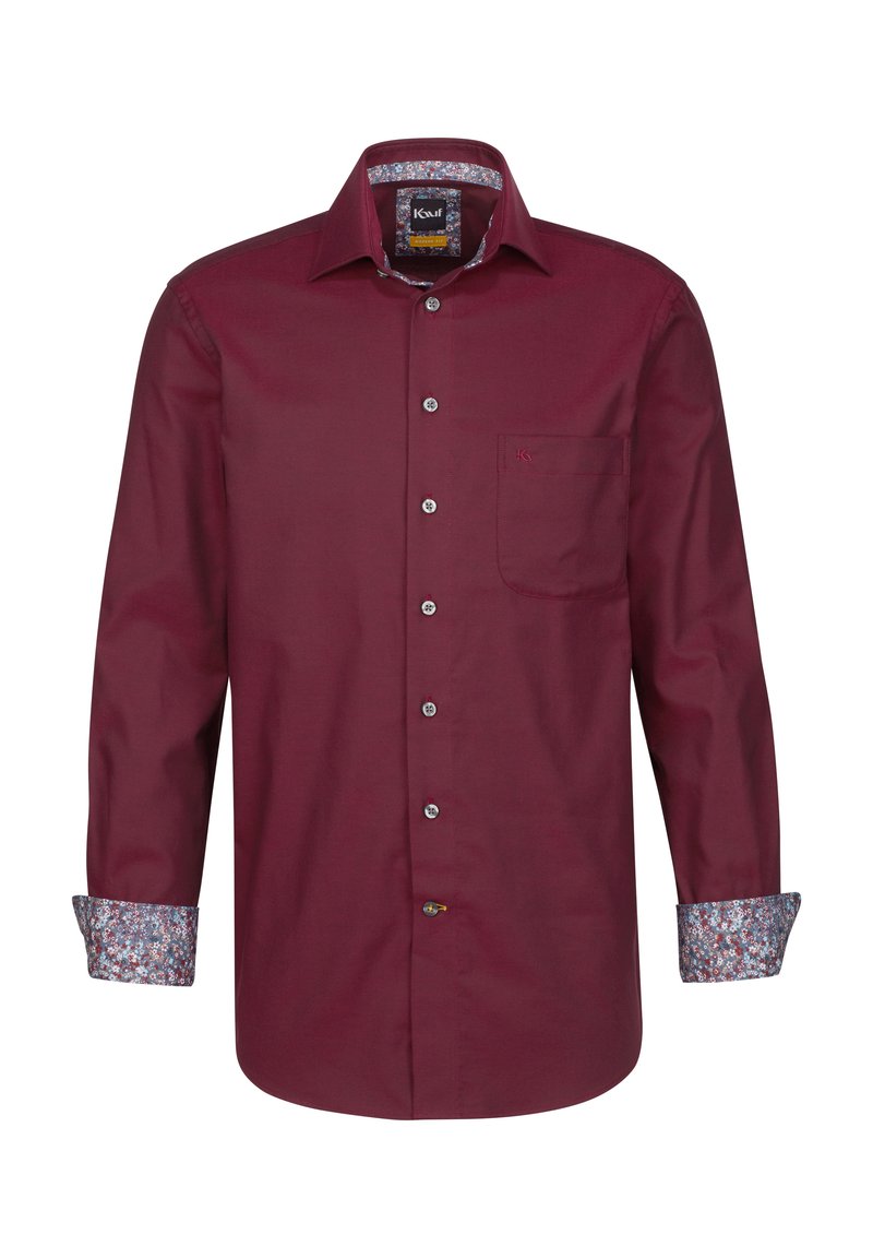 Camicia bordeaux a maniche lunghe con colletto a punta, chiusura a bottoni e tasca sul petto. Il colletto interno e i polsini presentano un motivo floreale.