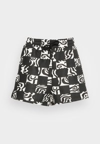 Shorts à carreaux noir et blanc avec des motifs abstraits de lignes ondulées et un cordon noir à la taille élastique sur un fond uni.