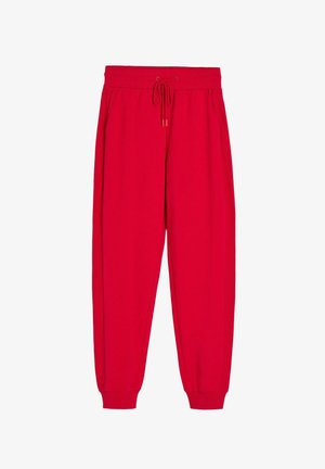 Czerwone spodnie dresowe z elastycznym pasem i sznurkiem do regulacji, bocznymi kieszeniami oraz ściągaczami przy nogawkach.