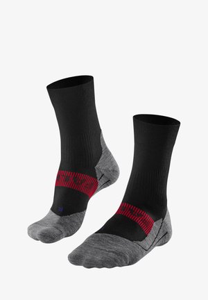 Calze sportive nere e grigie con polsini a coste, una fascia a motivi rossi e tallone e punta rinforzati per maggiore durata e comfort.