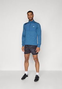 New Balance ATHLETICS GRID 1/2 ZIP - Top dugih rukava - dark shoreline/blue heather