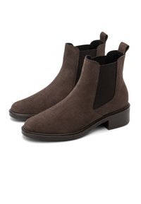Brown suede ankle boots with elastic side panels, rounded toe, and a low stacked heel. Smooth texture and minimalistic design.