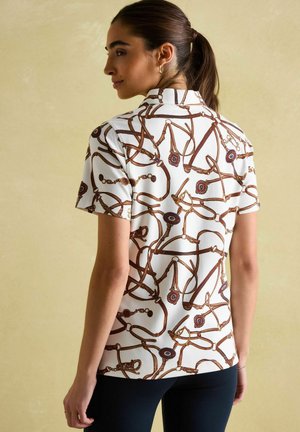 Short-sleeve white shirt featuring a brown and blue equestrian print, with a classic collar and smooth texture. Rear view shown.