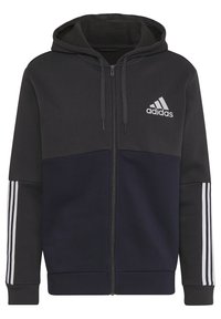 Sweat à capuche Adidas noir et bleu marine foncé avec fermeture éclair intégrale, capuche, cordons, trois bandes blanches sur les manches et logo Adidas sur la poitrine.