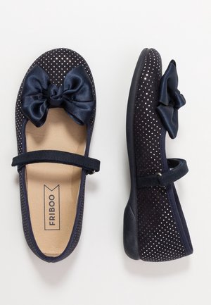 Granatowe dziewczęce buty typu Mary Jane z srebrnymi groszkami, satynową kokardką na palcu i paskiem na rzep przez stopę.