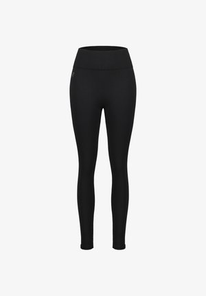 Leggings noirs en tissu extensible. Taille haute, coupe ajustée, construction sans coutures, sans logos ni ornements visibles.