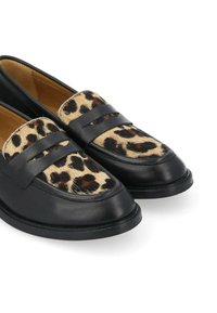 Black leather loafers with a leopard print hair-on-hide panel, featuring two decorative straps across the vamp and a rounded toe design.