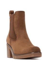 Stivale ankle in suede marrone con pannelli laterali elastici, punta rotonda e tacco grosso. La suola presenta una gomma testurizzata per una maggiore aderenza.