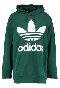 Grön hoodie i bomullsblandning, med en vit Adidas-logotyp och tre ränder. Har en framficka och justerbar dragsko i huvan.