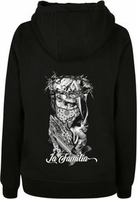Black hoodie featuring a graphic design on the back with a figure crowned in thorns, surrounded by intricate patterns, and text reading "La Familia."