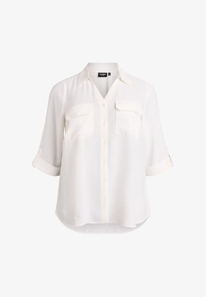 White button-up shirt made from lightweight fabric, featuring a V-neckline, two chest pockets, and roll-up sleeves. Smooth texture.