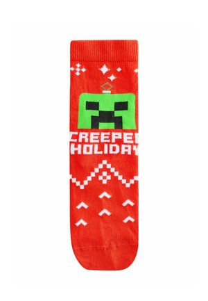 Rode sokken met een groen pixelachtig karakterontwerp, "CREEPY HOLIDAY" in witte tekst en witte geometrische patronen. Gebreide structuur.