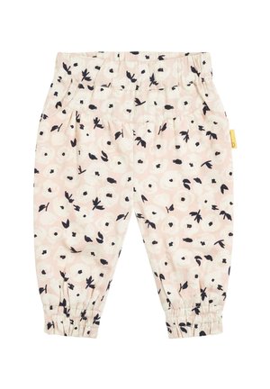 Leggings rose clair avec un motif floral en noir et blanc. Possède une taille élastique et des poignets froncés aux chevilles.