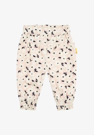 Leggings de color rosa claro con un patrón floral en blanco y negro. Presentan una cintura elástica y puños fruncidos en los tobillos.