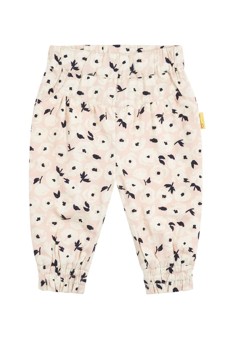 Leggings rose clair avec un motif floral en noir et blanc. Possède une taille élastique et des poignets froncés aux chevilles.