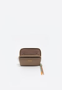 Zip-around wallet in smooth brown material with a gold logo. Includes a textured green and orange zipper pull, featuring an interior card slot layout.