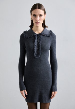 Gray ribbed knit dress with long sleeves, a frilled collar, and button front. Texture is smooth with a form-fitting silhouette.
