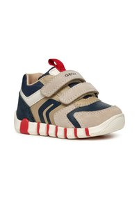 Sneakers per bambini con una combinazione di colori beige, blu e rosso. Presentano chiusure in velcro, una tomaia in tessuto testurizzato e una suola decorata.
