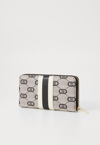 Wallet featuring a patterned fabric in gray with black motifs, a white and black striped detail, and gold hardware zipper closure.