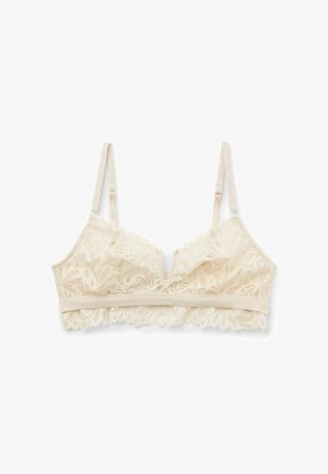Spitzen-Bralette in Creme, mit floralen Mustern, einem V-Ausschnitt-Design, verstellbaren Trägern und einem weichen, gewellten Saum.