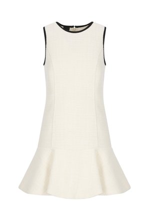 Abito senza maniche color crema con tessuto testurizzato, orlo svasato e rifiniture nere intorno al collo e alle aperture delle maniche. Chiusura con cerniera sul retro.