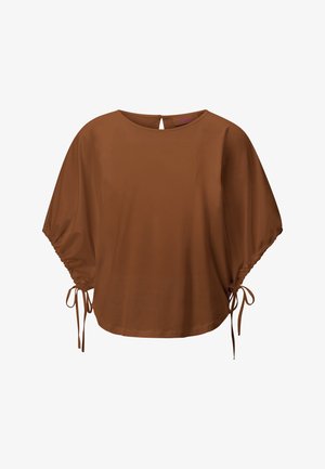 Ruda palaidinė su laisvomis, alkūnės ilgio rankovėmis, kuriose yra reguliuojamos raišteliai, ir apvalia iškirpte su galine sagos užsegimu.