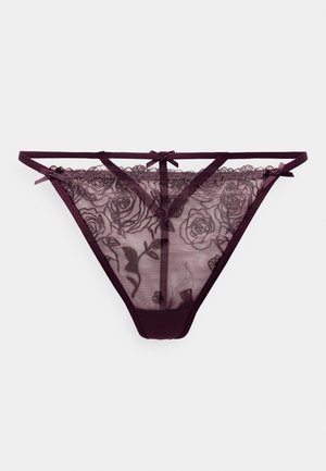 Tanga de encaje en burdeos profundo, con bordados florales, detalles de malla transparente y lazos decorativos en las tirantes. Tejido elástico para mayor comodidad.