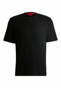 Zwart kortomshirt van gestructureerde stof met een ronde hals. Kenmerkt zich door een klein zwart 'HUGO' logo op de borst en een rood label aan de binnenkant.