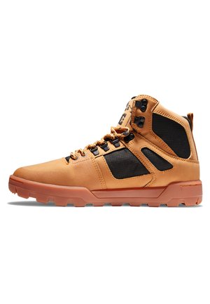 Brown leather mid-top shoes with black textile accents, lace-up design, and rubber outsole featuring textured grip pattern.