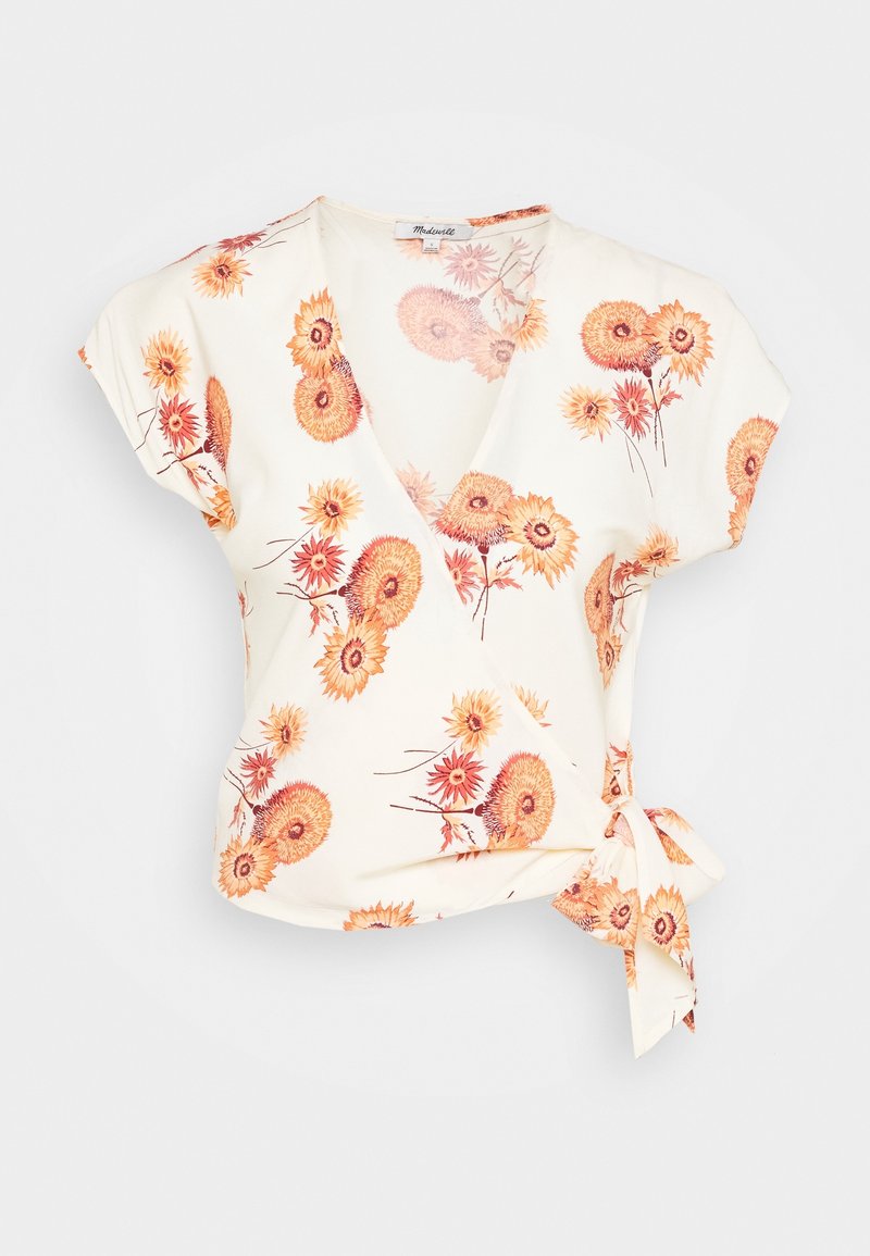 Květinový top s hlubokým výstřihem ve smetanové barvě. Má vzory oranžových a žlutých květin, krátké rukávy a detail vázání na boku.