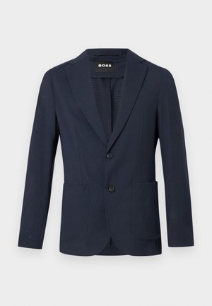 Laivastonsininen miesten bleiseri, jossa on kaksi nappia, lovikaulukset, paikkataskut ja kevyt teksturoitu kangas.