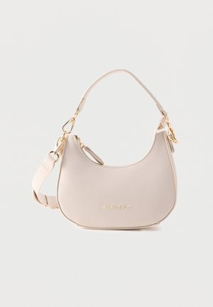 Small beige Valentino handbag with curved shape, gold hardware, top handle, detachable shoulder strap, and front logo detail.