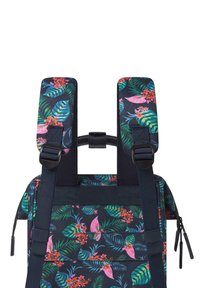 Backpack with navy fabric featuring vibrant floral and leaf patterns in pink, green, and orange. Adjustable padded straps for comfort.