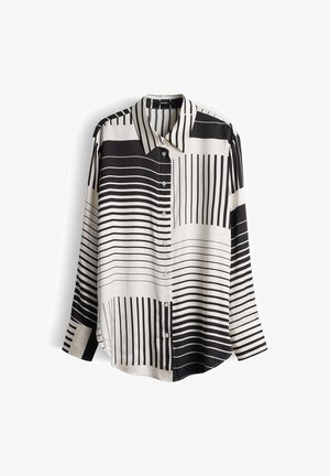 Langarmshirt in zwart en wit met afwisselend horizontale en verticale strepen, voorzien van een knoopsluiting aan de voorkant en een kraag.