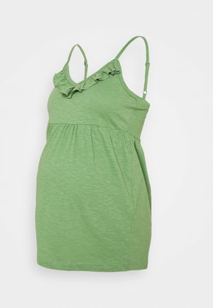 Grøn graviditetstop med flæsekant ved halsudskæringen og justerbare spaghettistropper, rynket under brystet for fleksibilitet og komfort.