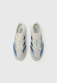 Pair of white and blue Adidas Adizero running shoes with laces, viewed from above on a plain white background.