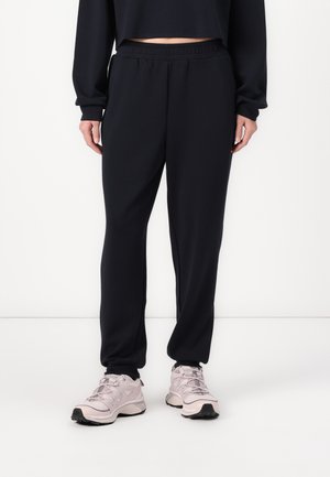 RISE VIBE PANTS - Tracksuit bottoms - black