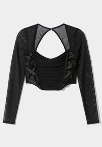 Maglietta nera a maniche lunghe, corta con un corpetto aderente, davanti arricciato, design con schiena scoperta e dettagli in nastro di satin ai lati. Maniche in rete tessurizzata.