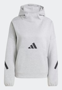 Sweat à capuche gris clair avec une grande poche sur le devant, logo Adidas noir sur la poitrine et bandes noires sur les manches.