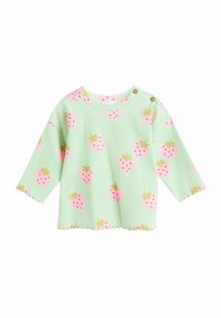 Ljusgrön långärmad topp med ett jordgubbsmönster i rosa och gult. Texturerat ribbat tyg med en vågig nederkant och tryckknappar.