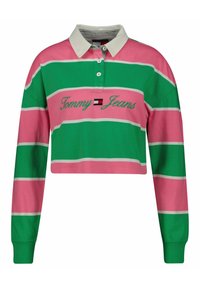 Crop top i gröna och rosa ränder, med en vit krage och långa ärmar. Broderad "Tommy Jeans"-logotyp i grönt framtill.