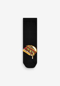Sorte sokker med et farverigt, broderet hamburgerdesign, der har salat, tomat, ost og en sesambolle.