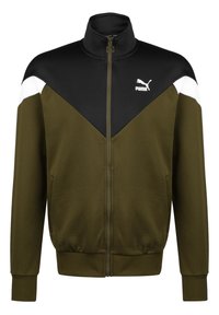 Puma zip-up jacket featuring a black upper section with olive green lower, white accents on shoulders, and a stand collar. Soft fabric texture.