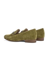 Green suede loafers with a low stacked heel, featuring silver hardware accents and a rounded toe design. Smooth texture throughout.