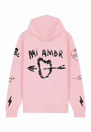 Haut à capuche rose pâle en tissu doux. L'avant présente le texte noir "Mi Amor" et des graphismes, y compris des coeurs, une tête de mort et des flèches sur les manches.