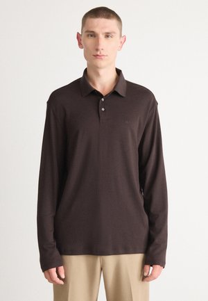 Brown long-sleeve polo shirt made of soft fabric, featuring a collared neckline, three-button placket, and subtle logo on the chest.