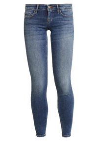 Vaqueros ajustados en denim oscuro deslavado, que cuentan con un diseño de cinco bolsillos, cremallera con botón y detalles cosidos a lo largo de las costuras.