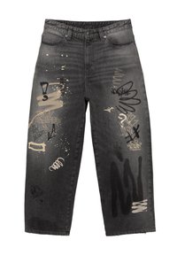 Svarta denimjeans med lös passform, slitna detaljer och graffitistil i beige och svart på benen.