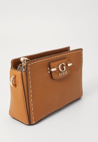Brown textured leather handbag with a gold hardware clasp, logo detailing, and contrasting stitching along the edges. Rectangular shape.