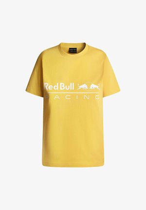 Gul bomulds T-shirt med korte ærmer, der har et hvidt "Red Bull Racing" logo på forsiden og en rund halsudskæring.